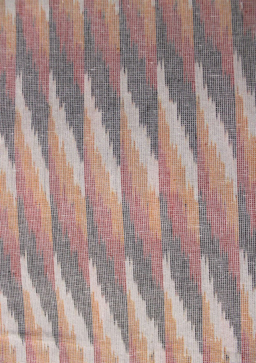 Yarn-dyed cotton ikat fabric in warm tones