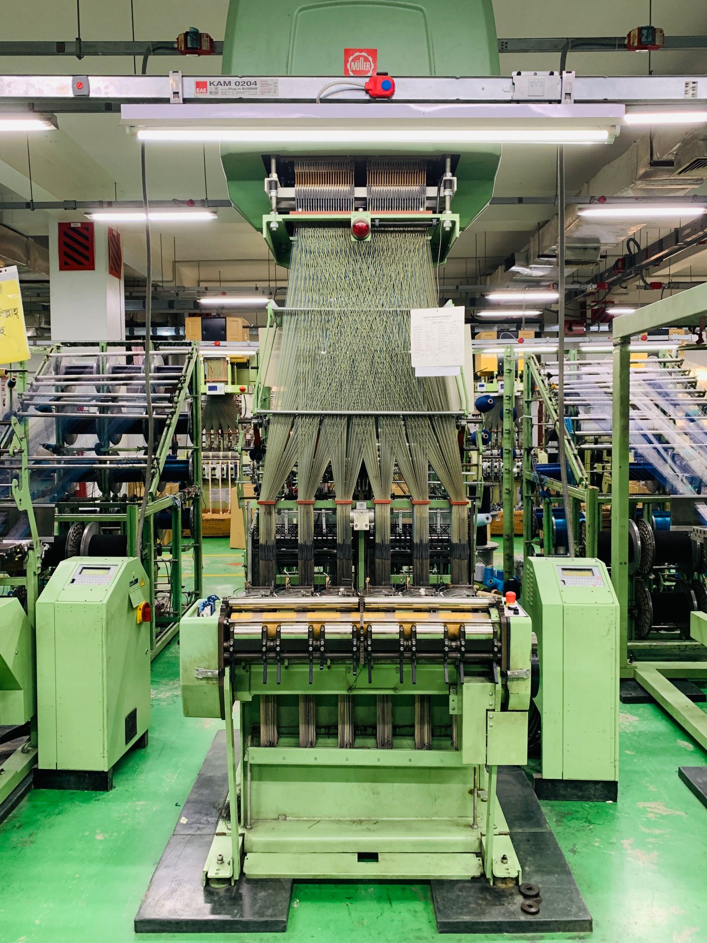 Weaving machines running at speed inside the mill