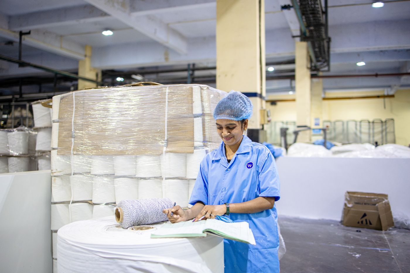 Production checks against the record sheet in the quality-control bay